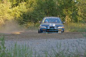 Martin Menning / Ryan Schnell come onto the county road in their Subaru Impreza at the spectator point on SS14.