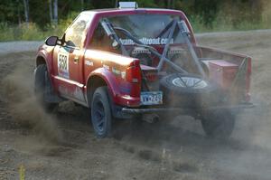 Jim Cox / Chris Stark enter onto the county road at the spectator point on SS14 in their Chevy S-10.