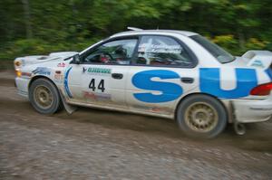 Henry Krolikowski / Cindy Krolikowski hit the gas on their Subaru WRX at the start of SS16.