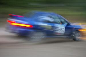 Kyle Sarasin / Stuart Sarasin at speed at dusk in their Subaru Impreza 2.5RS on SS16.