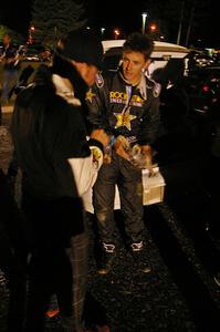 Tanner Foust shows his wheel that he destroyed to Matthew Johnson. Tanner hit a large rock at speed on the second to last stage.