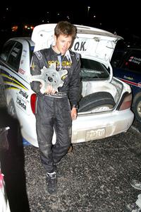 Tanner Foust displays the wheel that he destroyed after hitting a large rock at speed on SS16 (1).