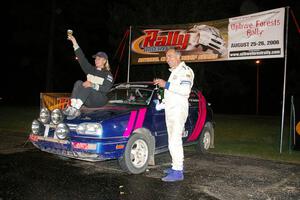 Kathy Jarvis and Martin Headland raise their glasses as they were the sole finishers in the Production class in their VW GTI.