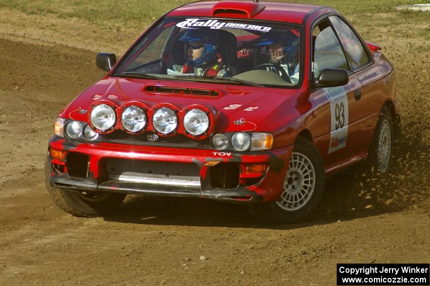 Bob Olson / Ryan Johnson throw gravel on SS1 at the Bemidji Speedway in their Subaru Impreza.