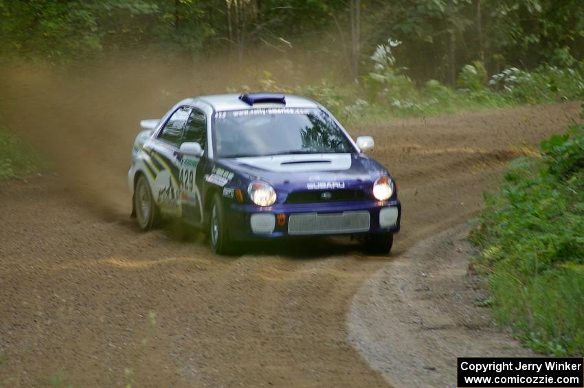 Tanner Foust / Chrissie Beavis Subaru WRX at a fast left-hander near the end of SS2.