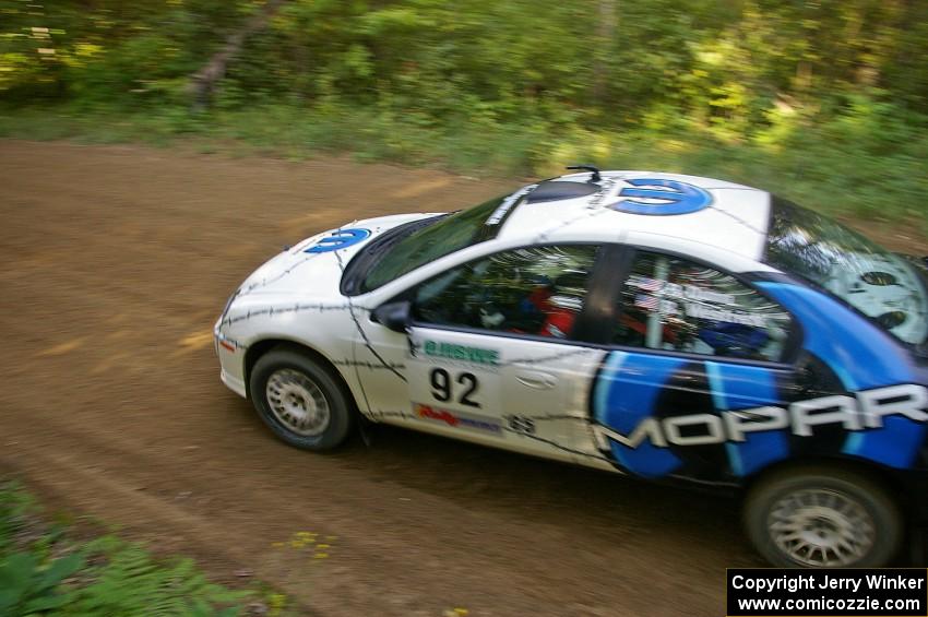 Paul Dunn / Bill Westrick in their Dodge SRT-4 at a fast left-hander on SS2.