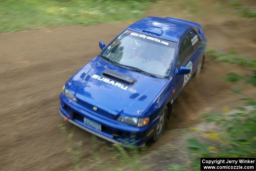 Kyle Sarasin / Stuart Sarasin struck a last minute deal to drive in Bob Olson's Subaru Impreza seen here on SS2.