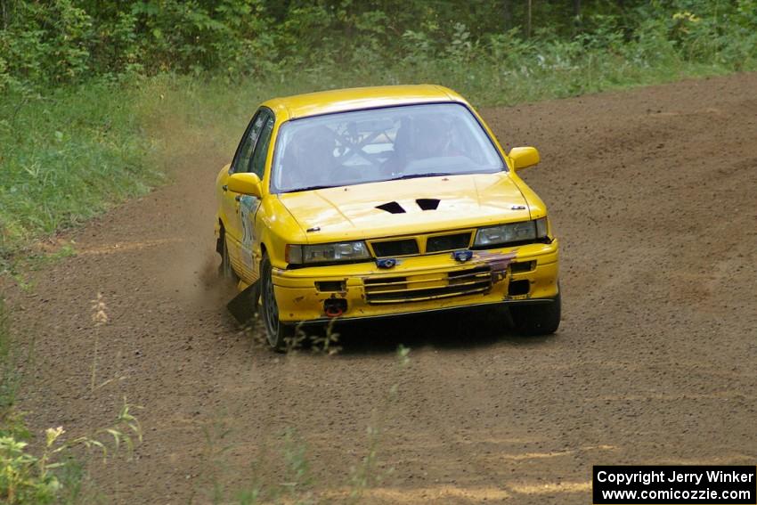 Erik Payeur / Adam Payeur Mitsubishi Galant at speed through a fast left-hander on SS2.