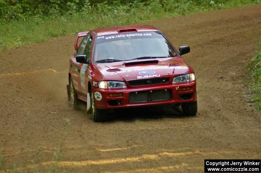 Erik Schmidt / Mike Rose at speed through a fast left-hander on SS2 in their Subaru Impreza.