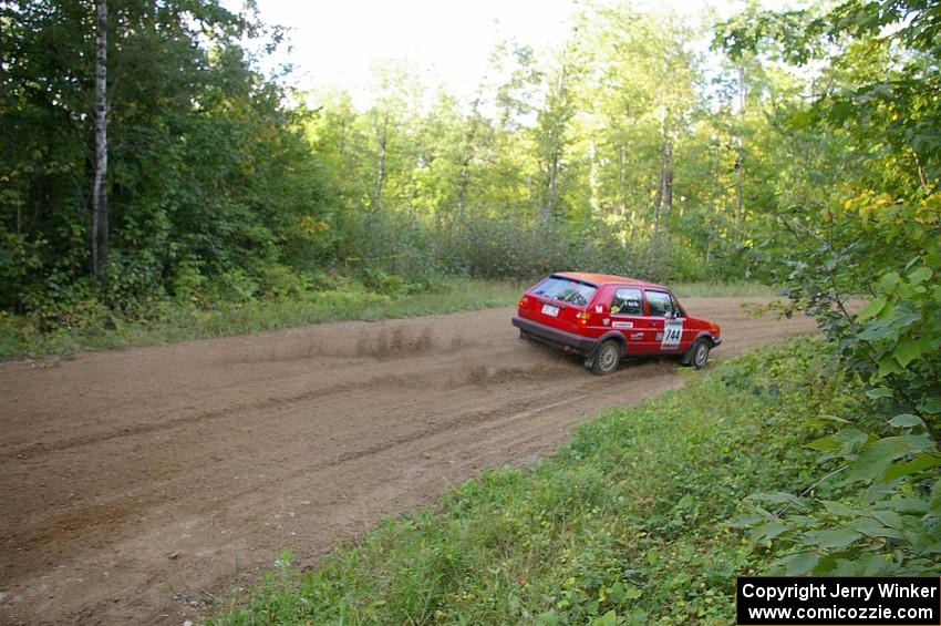 Paul Koll / Matt Wappler VW GTI flies downhill into the flying finish of SS2.