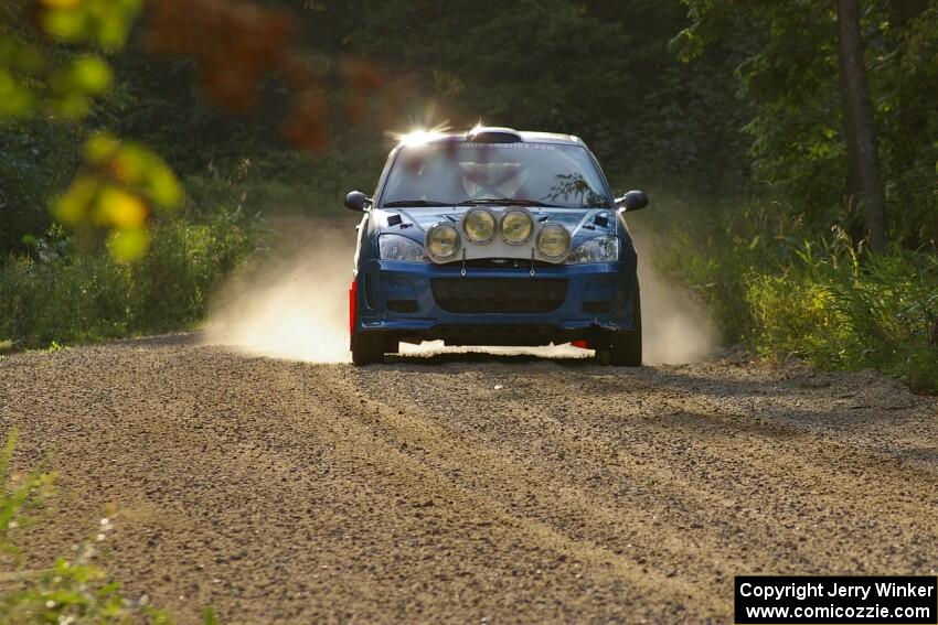 Adam Boullion / Phil Boullion Ford Focus comes across the finish of SS2.