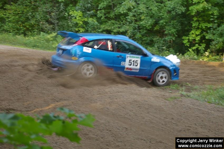 Adam Boullion / Phil Boullion Ford Focus hits the hairpin on SS3 perfectly and gasses it hard.