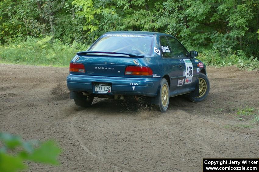 Martin Menning / Ryan Schnell Subaru Impreza at a hairpin on SS3.