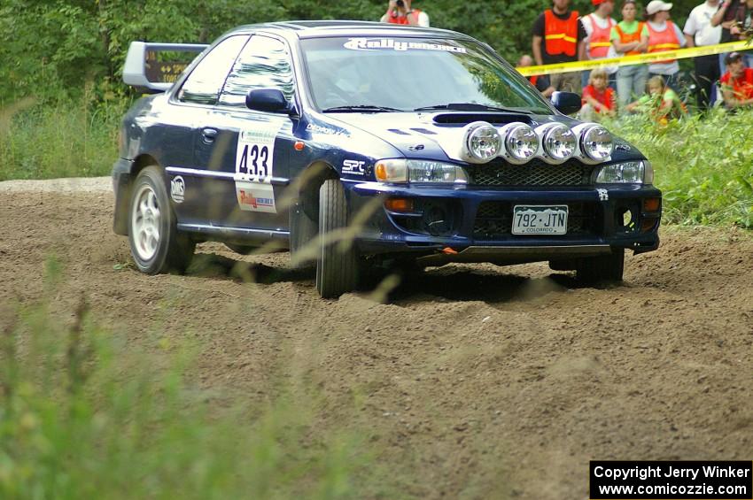 Mitch Williams / Alix Hakala Subaru Impreza at a hairpin on SS3.