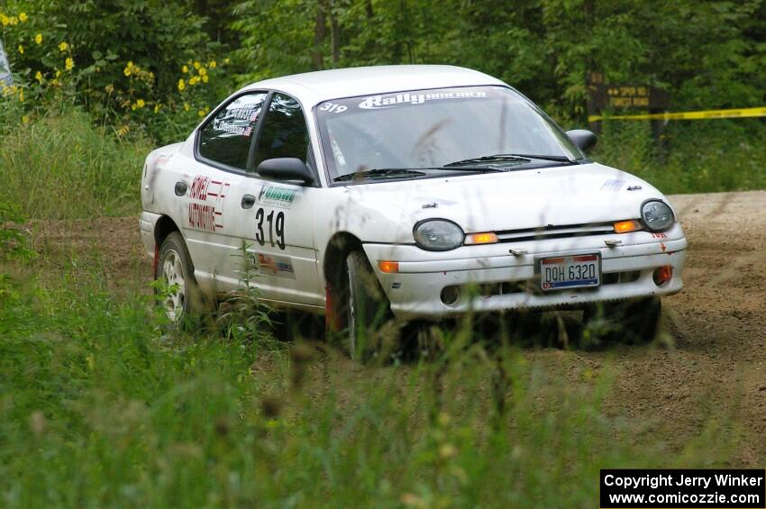 Chris Greenhouse / Don DeRose exit out of a hairpin on SS3 in their Plymouth Neon.