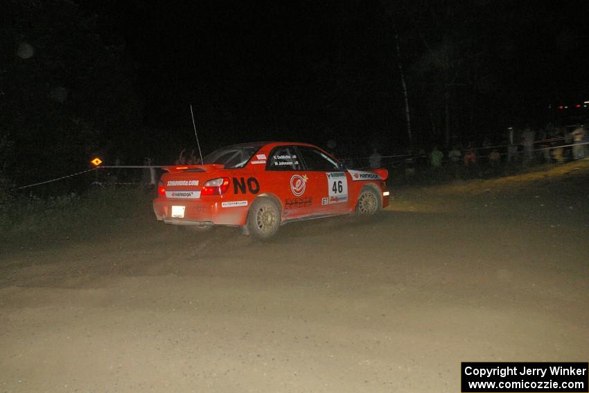 Matthew Johnson / Kim DeMotte Subaru WRX blows the corner and comes face-to-face with a crowd of spectators on SS8, Kabekona.