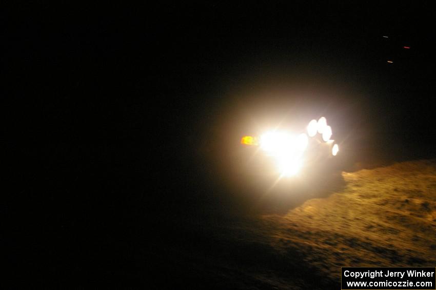 Chris Gilligan / Joe Petersen Mitsubishi Lancer Evo IV at the spectator point on SS8, Kabekona.