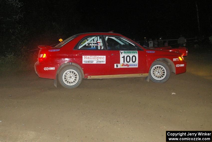 Dave Anton / Dominik Jozwiak carry too much speed into the spectator point on SS8, Kabekona, in their Subaru WRX STi.