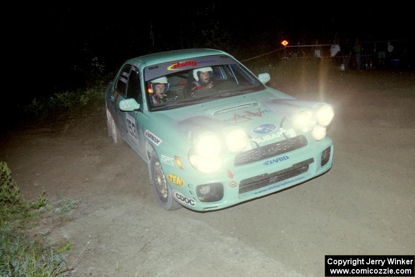 Eric Langbein / Jeremy Wimpey sling gravel in their Subaru WRX at a 90 right-hander on SS8, Kabekona.