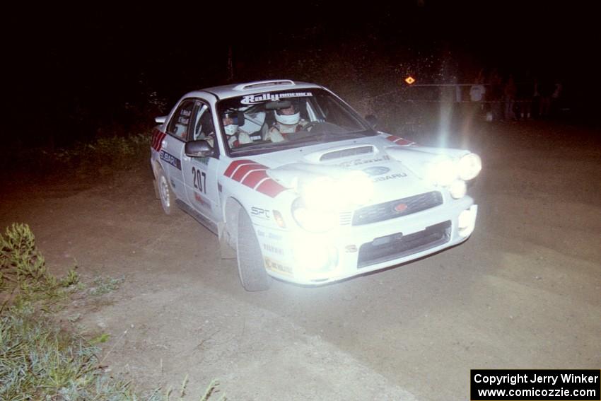 Dave Hintz / Rick Hintz reapply the throttle at a right-hander at the SS8, Kabekona, spectator point in their Subaru WRX.