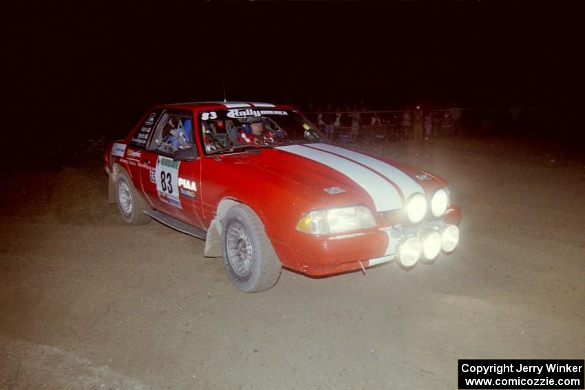 Mark Utecht / Rob Bohn at speed through a 90-right at the crossroads on SS8, Kabekona, in their Ford Mustang.