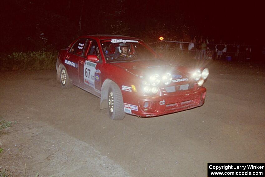 Bryan Pepp / Jerry Stang power out of a 90-right at the spectator point on SS8, Kabekona, in their Subaru WRX.