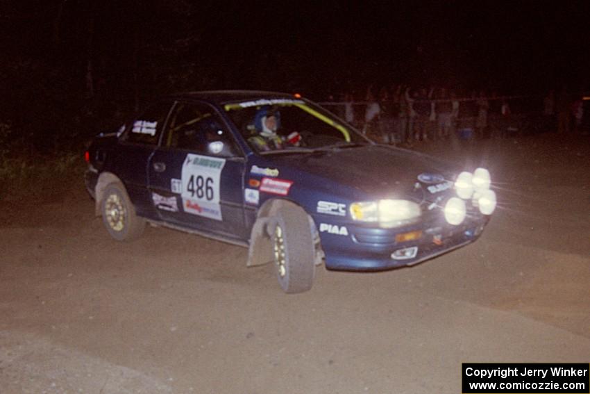 Martin Menning / Ryan Schnell Subaru Impreza at the spectator point on SS8, Kabekona.