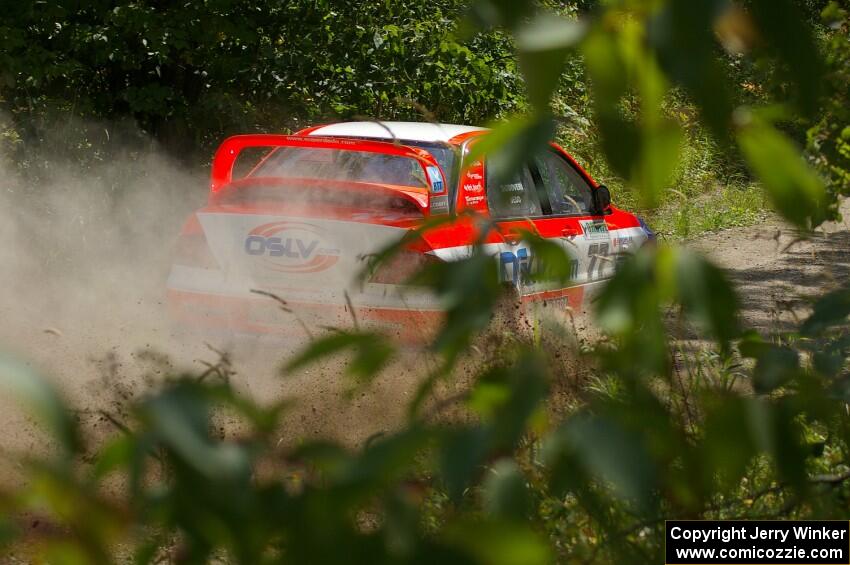 Alfredo DeDominicis / Massimo Daddovei prepare to rocket down a short straight on SS9 in their Mitsubishi Lancer Evo VII.