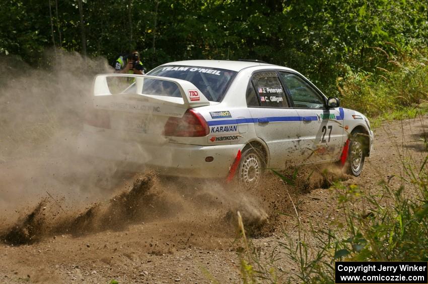 Chris Gilligan / Joe Petersen drift their Mitsubishi Lancer Evo IV through loose gravel on SS9.