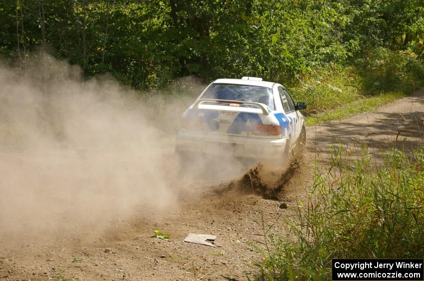 Henry Krolikowski / Cindy Krolikowski get their car straightened out after a left-hander on SS9 in their Subaru WRX.