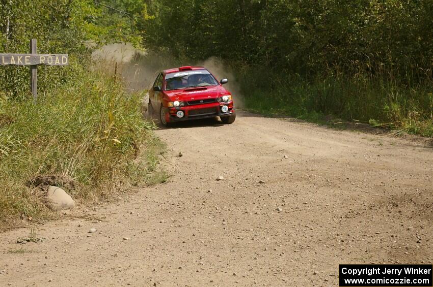 Bob Olson / Ryan Johnson prepare for a hard 90-left on SS9 in their Subaru Impreza.