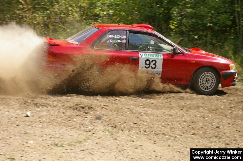 Bob Olson / Ryan Johnson drift through a 90-left on SS9 in their Subaru Impreza.