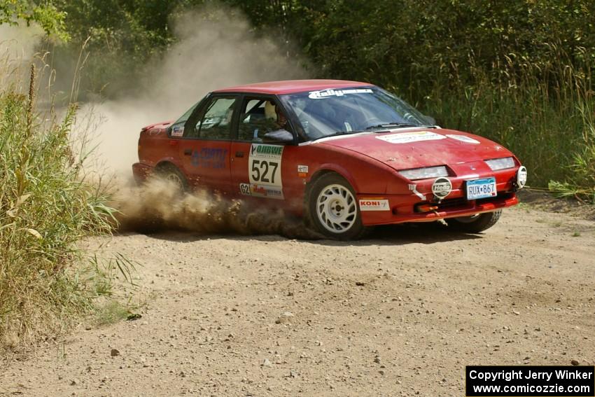 Craig Walli / Jonah Liubakka Saturn SL2 at speed on a 90-degree left-hander on SS12.