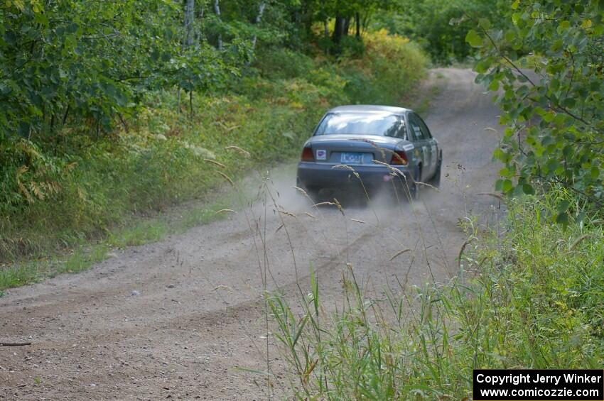 Dan Adamson / Jeremiah Schubitzke hit the gas after a hard left in their Saturn SL2.