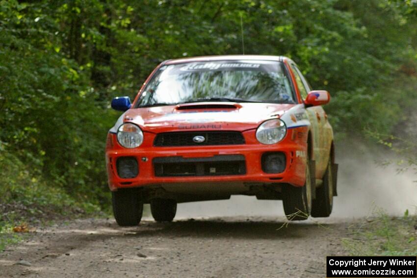 Matthew Johnson / Kim DeMotte Subaru WRX catches decent air on the jump on SS13.