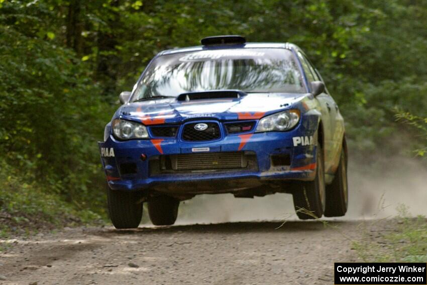 Otis Dimiters / Alan Ockwell catch manor air at the yump on SS13 in their Subaru WRX STi.