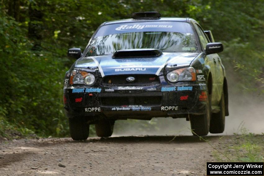 Jonathan Bottoms / Carolyn Bosley Subaru WTX STi gets slight air at the jump on SS13.