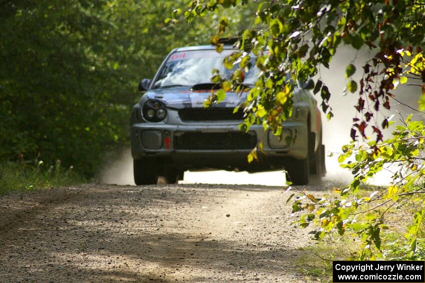 Robert Borowicz / Mariusz Borowicz caught no air at the jump on SS13 in their Subaru WRX STi.