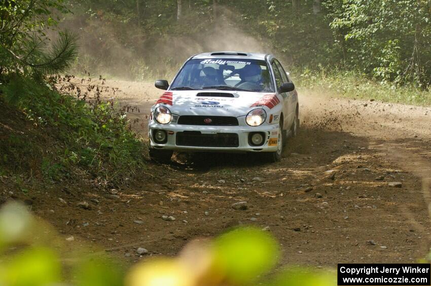 Dave Hintz / Rick Hintz drift through a tight at a right-hander on SS13 in their Subaru WRX.