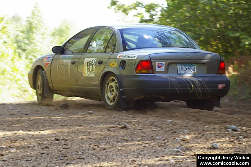 Dan Adamson / Jeremiah Schubitzke at uphill right on SS13 in their Saturn SL2.