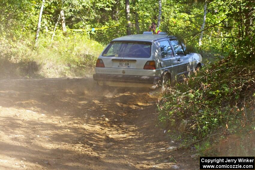 Chad Eixenberger / Jay Luikart VW Golf exit out of an uphill right-hander on SS13.