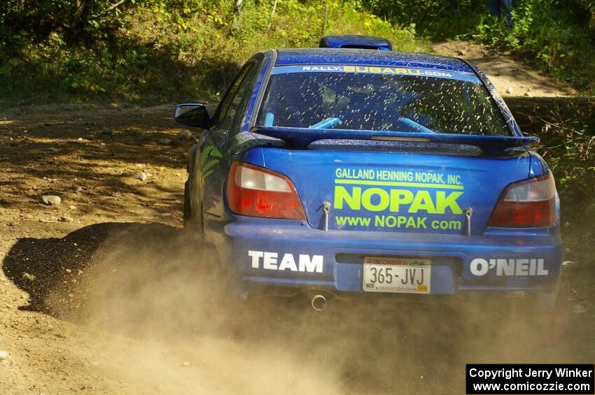 Heath Nunnemacher / Travis Hanson Subaru WRX at an uphill right on SS13.