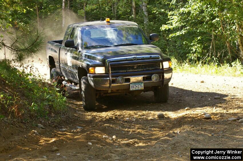 A gigantic Dodge diesel sweep truck.