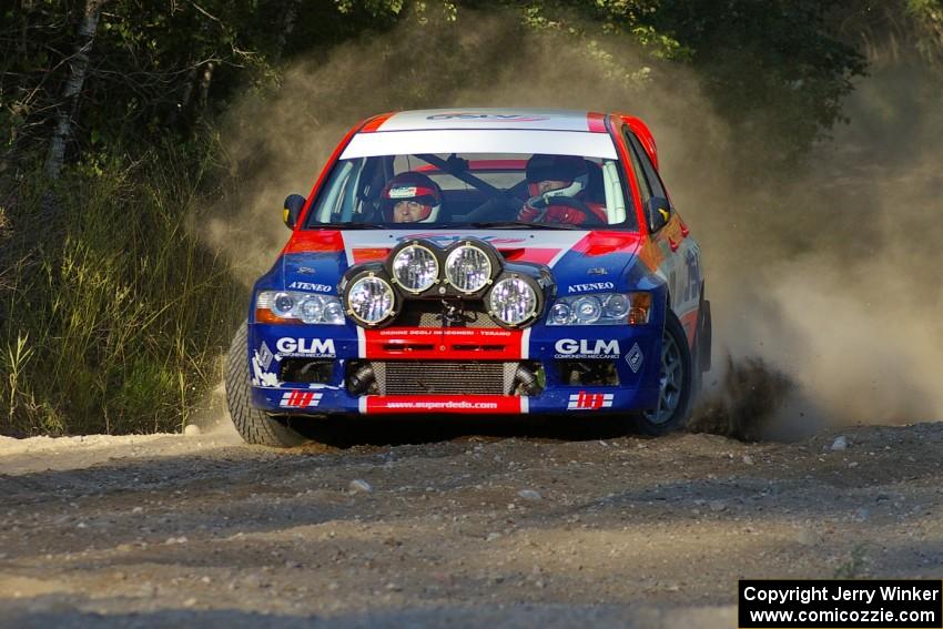 Alfredo DeDominicis / Massimo Daddovei go onto the county road on SS14 in their Mitsubishi Lancer Evo VII.