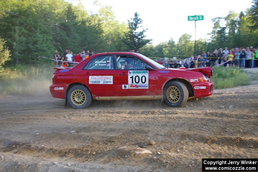 Dave Anton / Dominik Jozwiak go wide at the spectator corner on SS14 in their Subaru WRX STi.