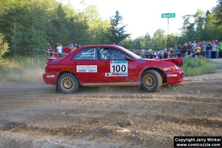 Dave Anton / Dominik Jozwiak go wide at the spectator corner on SS14 in their Subaru WRX STi.