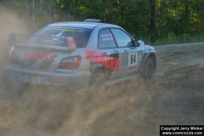 Robert Borowicz / Mariusz Borowicz power out of a right-hander at the spectator point on SS14 in their Subaru WRX STi.