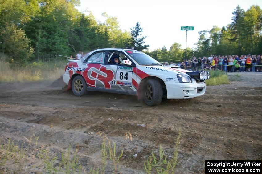Greg Drozd / John Nordlie drive past the horde of spectators at SS14 in their Subaru WRX.