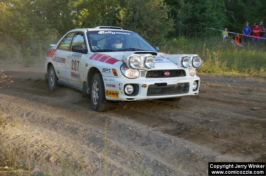 Dave Hintz / Rick Hintz drift through a right-hander at the spectator point on SS14 in their Subaru WRX.