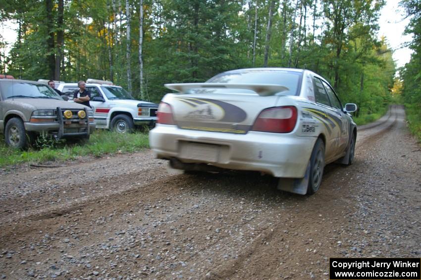 Tanner Foust / Chrissie Beavis Subaru WRX pulls away carefully from the start of SS16.